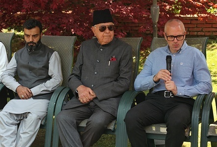 Former Jammu and Kashmir chief minister and vice president of the National Conference (NC) party Omar Abdullah (R) speaks next to his father and party President Farooq Abdullah (C) and party senior leader Aga Syed Ruhullah Mehdi during a press conference in Srinagar on April 12, 2024, ahead of India's upcoming general elections. National Confrence (NC) party President Farooq Abdullah on April 12 announced election candidates Omar Abdullah for Baramulla and Aga Syed Ruhullah Mehdi for Srinagar.