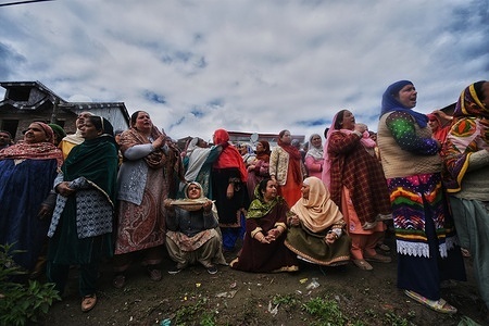 Family members and relatives cry after a boat carrying people including children capsized in Jhelum river on the outskirts of Srinagar, Indian Administrated Kashmir, Tuesday, April. 16, 2024. Rescue operation is continuing for the several missing people.